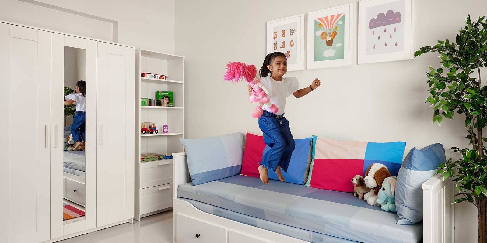 girl playing on sofa